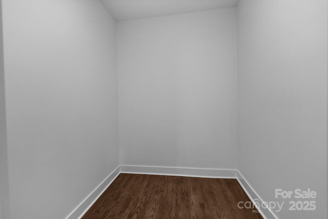 1922 Thomas Ave, Charlotte, NC 28205 - unfurnished room with dark wood-type flooring and baseboards