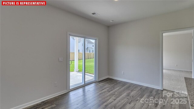 8036 Kennesaw Dr, Gastonia, NC 28056 - empty room featuring plenty of natural light, wood finished floors, and baseboards