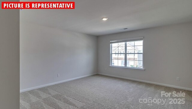 8036 Kennesaw Dr, Gastonia, NC 28056 - carpeted empty room with baseboards
