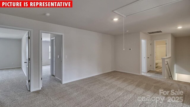 8036 Kennesaw Dr, Gastonia, NC 28056 - carpeted empty room featuring attic access, a smoke detector, baseboards, and recessed lighting