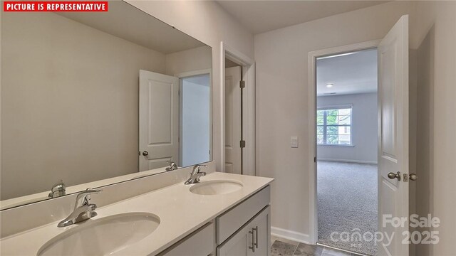 8036 Kennesaw Dr, Gastonia, NC 28056 - full bath with double vanity and baseboards
