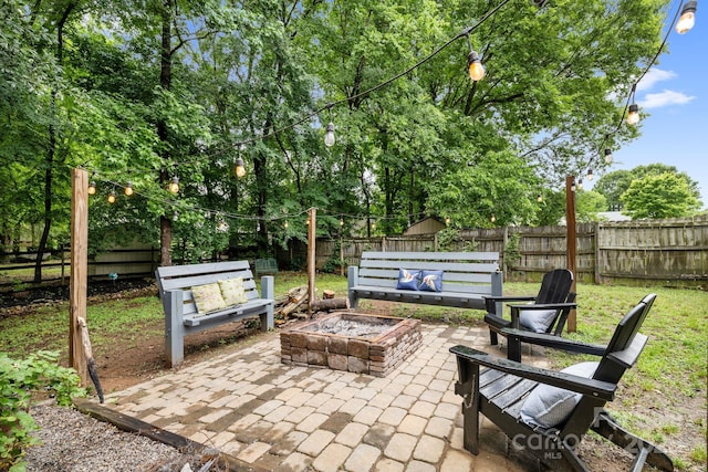4236 Carrington Ct SW, Concord, NC 28027 - fenced backyard featuring an outdoor fire pit and a patio