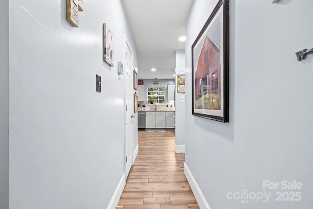 4236 Carrington Ct SW, Concord, NC 28027 - hallway featuring light wood-type flooring, recessed lighting, and baseboards