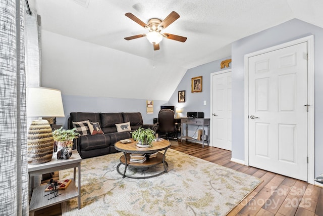 4236 Carrington Ct SW, Concord, NC 28027 - living area featuring lofted ceiling, a ceiling fan, a desk, and wood finished floors