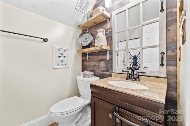 4236 Carrington Ct SW, Concord, NC 28027 - full bathroom with vanity, toilet, a textured ceiling, and a shower with curtain