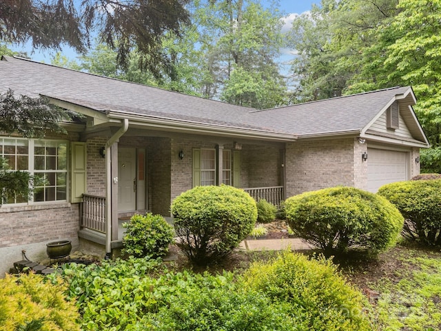 206 Pine Knot Trl, Hendersonville, NC 28739 - single story home featuring brick siding, a garage, a shingled roof, and a porch