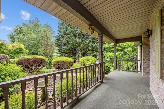 206 Pine Knot Trl, Hendersonville, NC 28739 - covered porch with view of scattered trees