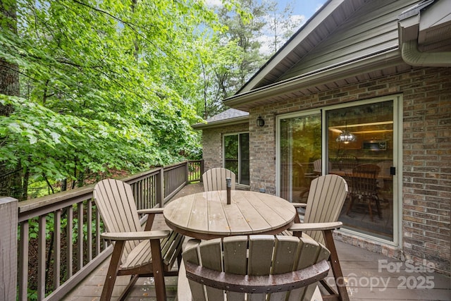 206 Pine Knot Trl, Hendersonville, NC 28739 - wooden deck featuring outdoor dining space
