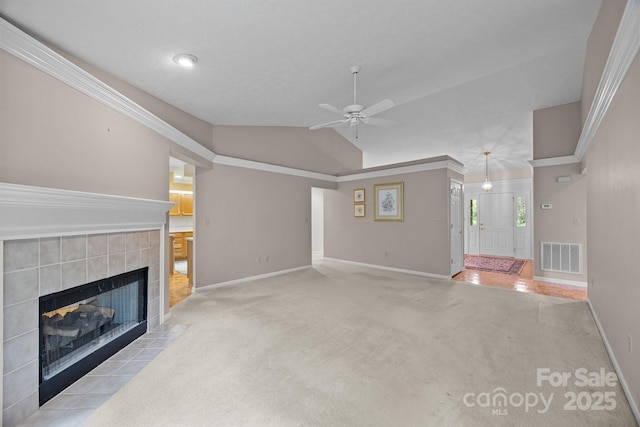 206 Pine Knot Trl, Hendersonville, NC 28739 - unfurnished living room with baseboards, a fireplace, ceiling fan, carpet flooring, and vaulted ceiling