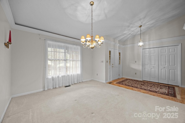 206 Pine Knot Trl, Hendersonville, NC 28739 - carpeted foyer entrance featuring a chandelier and baseboards