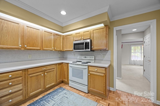 206 Pine Knot Trl, Hendersonville, NC 28739 - kitchen with stainless steel microwave, white electric range oven, light countertops, ornamental molding, and backsplash