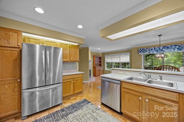 206 Pine Knot Trl, Hendersonville, NC 28739 - kitchen featuring stainless steel appliances, a sink, ornamental molding, light countertops, and hanging light fixtures