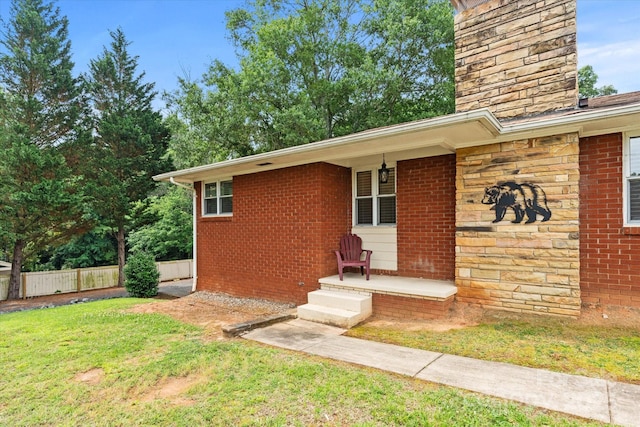 1810 13th Ave NE, Hickory, NC 28601 - entrance to property featuring a chimney, brick siding, and a porch