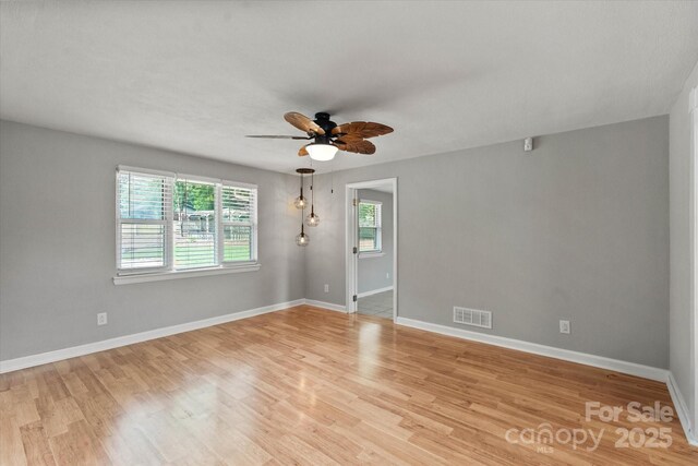 1810 13th Ave NE, Hickory, NC 28601 - spare room with a ceiling fan and light wood-style floors