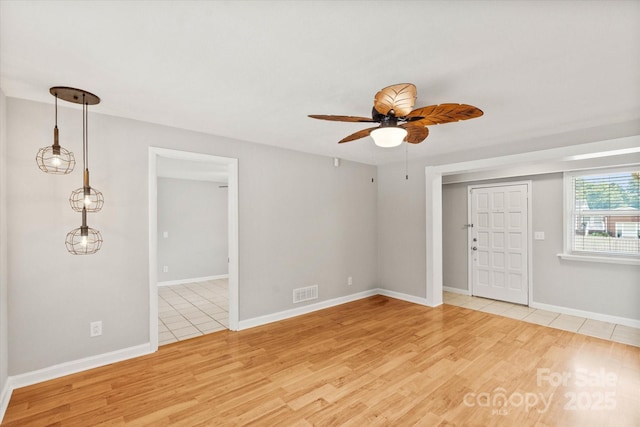 1810 13th Ave NE, Hickory, NC 28601 - empty room featuring a ceiling fan and light wood-type flooring