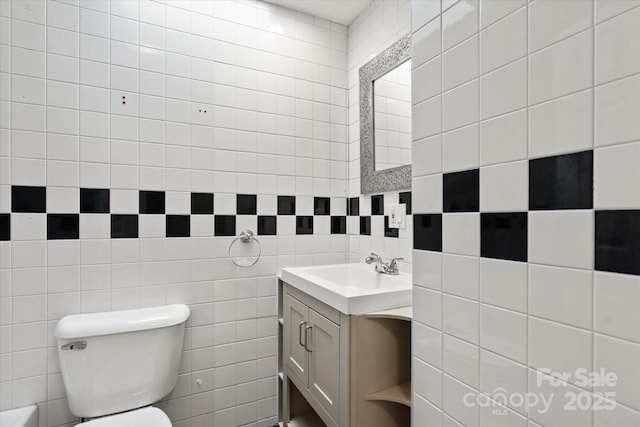 1810 13th Ave NE, Hickory, NC 28601 - bathroom featuring vanity, tile walls, and tasteful backsplash