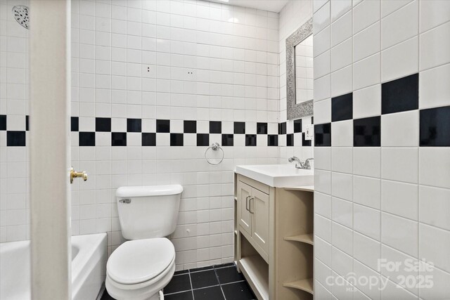 1810 13th Ave NE, Hickory, NC 28601 - full bathroom with tile walls, vanity, and tile patterned flooring
