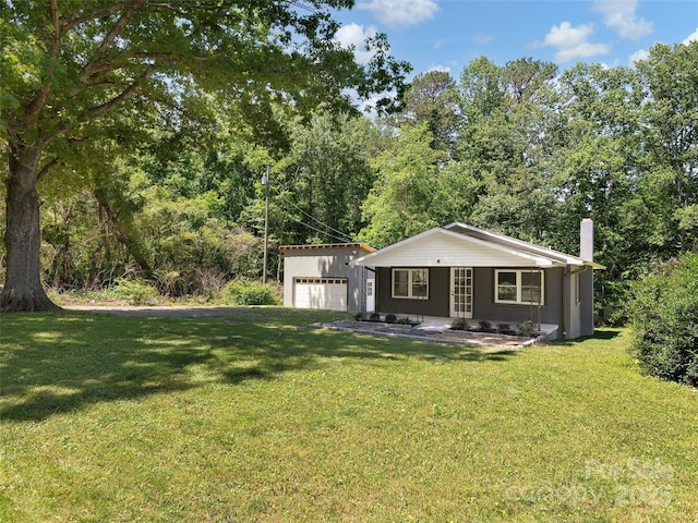 15 Burtiller Ln, Fletcher, NC 28732 - view of front of home featuring a front lawn, a garage, a porch, and a chimney