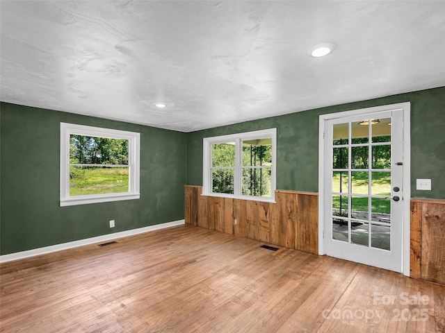 15 Burtiller Ln, Fletcher, NC 28732 - unfurnished room featuring wood finished floors, wainscoting, and wood walls