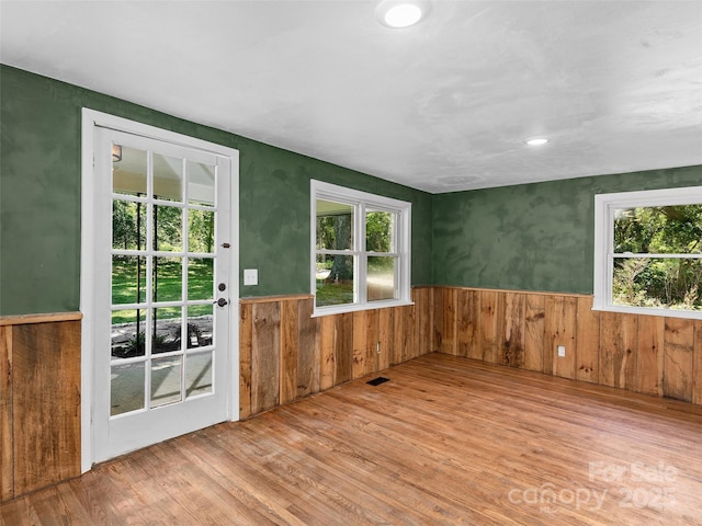 15 Burtiller Ln, Fletcher, NC 28732 - entryway with wood finished floors, plenty of natural light, a wainscoted wall, and wood walls