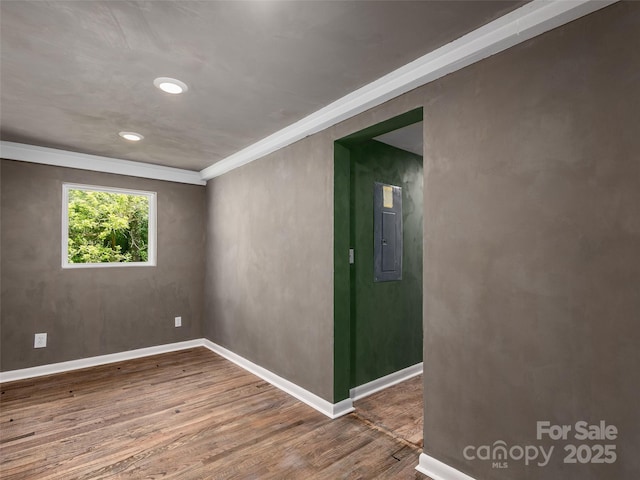 15 Burtiller Ln, Fletcher, NC 28732 - empty room with electric panel, wood finished floors, ornamental molding, baseboards, and recessed lighting