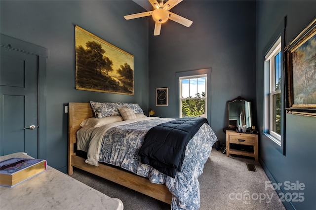 109 Druid Dr, Asheville, NC 28806 - bedroom with carpet floors, a towering ceiling, baseboards, and a ceiling fan