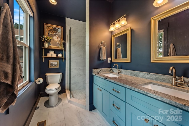 109 Druid Dr, Asheville, NC 28806 - full bathroom featuring toilet, double vanity, and a tile shower