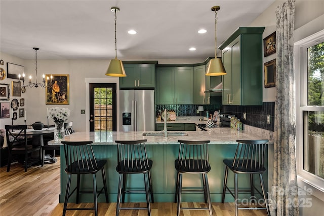 109 Druid Dr, Asheville, NC 28806 - kitchen featuring green cabinets, stainless steel refrigerator with ice dispenser, a sink, range with electric cooktop, and recessed lighting