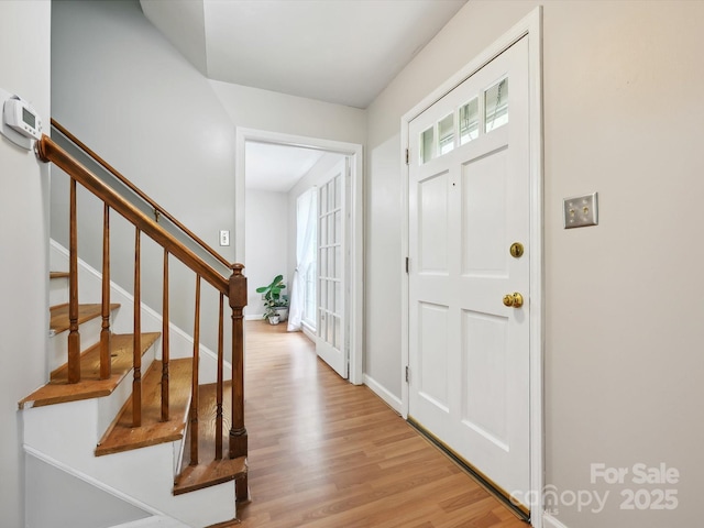 7317 Red Branch Ln, Charlotte, NC 28226 - entrance foyer with wood finished floors, stairway, and baseboards