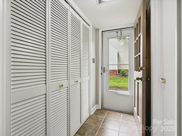 7317 Red Branch Ln, Charlotte, NC 28226 - doorway to outside featuring baseboards and stone finish floors