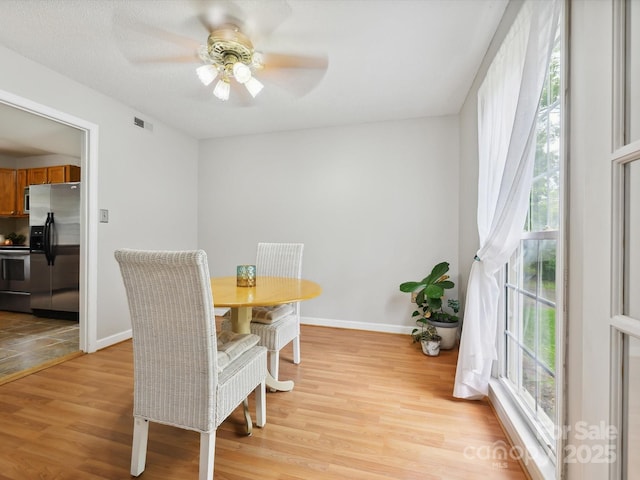 7317 Red Branch Ln, Charlotte, NC 28226 - dining area featuring light wood-style floors, baseboards, and a ceiling fan
