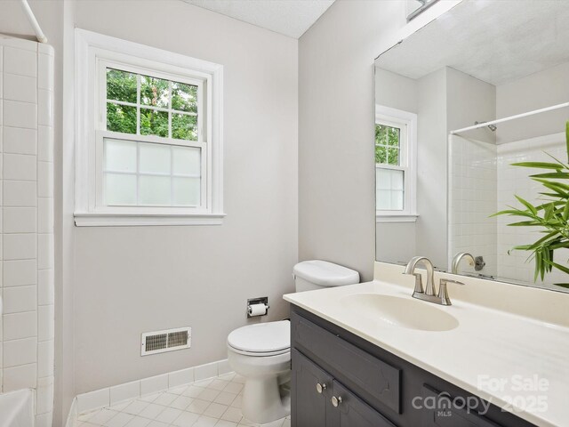 7317 Red Branch Ln, Charlotte, NC 28226 - full bathroom featuring vanity, toilet, tile patterned floors, shower / tub combination, and baseboards