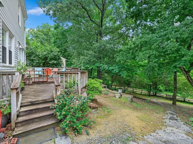 7317 Red Branch Ln, Charlotte, NC 28226 - view of yard with a wooden deck and view of scattered trees