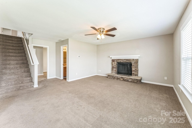 673 Shellbark Dr, Concord, NC 28025 - unfurnished living room with ceiling fan, stairway, carpet flooring, and baseboards