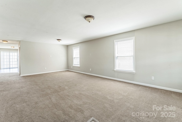 673 Shellbark Dr, Concord, NC 28025 - carpeted spare room featuring baseboards