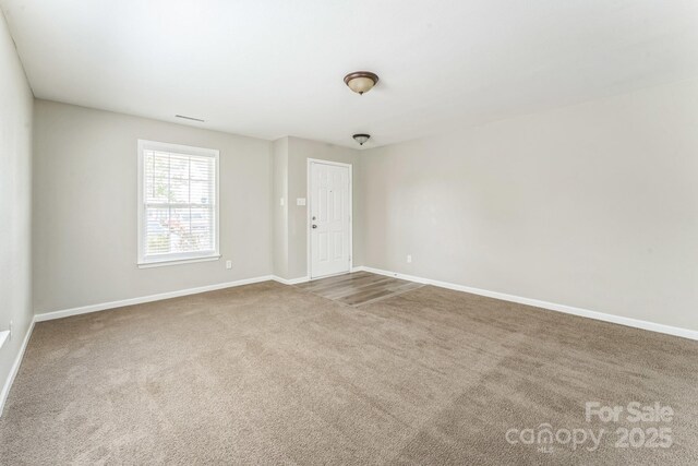 673 Shellbark Dr, Concord, NC 28025 - carpeted spare room with baseboards