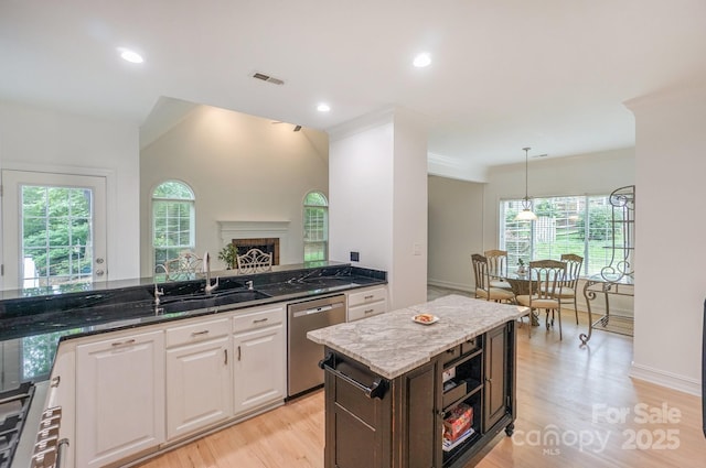 14831 Charterhouse Ln, Huntersville, NC 28078 - kitchen featuring a sink, stainless steel dishwasher, white cabinets, dark stone counters, and light wood-style floors