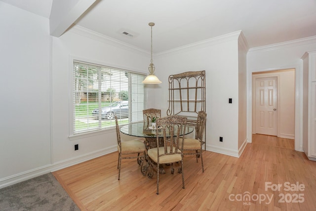 14831 Charterhouse Ln, Huntersville, NC 28078 - dining room featuring crown molding, light wood finished floors, and baseboards