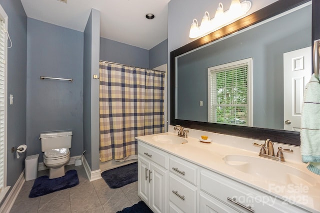 14831 Charterhouse Ln, Huntersville, NC 28078 - full bath with toilet, double vanity, tile patterned flooring, a shower with curtain, and baseboards