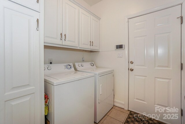 14831 Charterhouse Ln, Huntersville, NC 28078 - laundry room featuring washing machine and clothes dryer, cabinet space, and light tile patterned floors