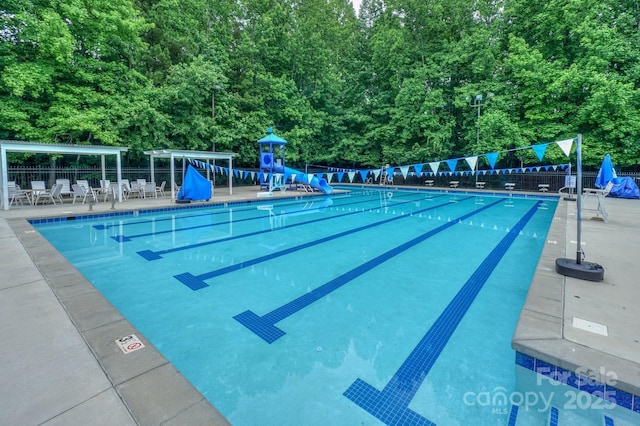 14831 Charterhouse Ln, Huntersville, NC 28078 - community pool with a water slide and a forest view