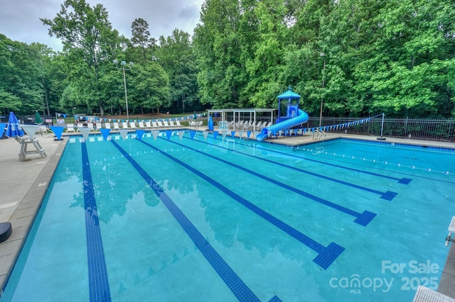 14831 Charterhouse Ln, Huntersville, NC 28078 - community pool with a water slide and a view of trees