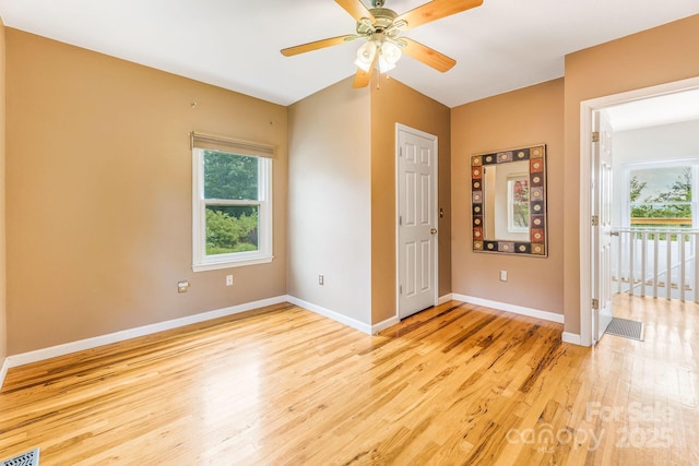 64 Mclain St, Asheville, NC 28803 - empty room featuring light wood-type flooring, healthy amount of natural light, ceiling fan, and baseboards