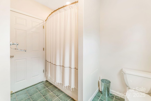 64 Mclain St, Asheville, NC 28803 - bathroom featuring toilet and a shower with shower curtain