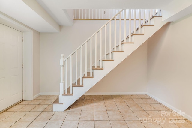 64 Mclain St, Asheville, NC 28803 - stairway featuring tile patterned floors and baseboards