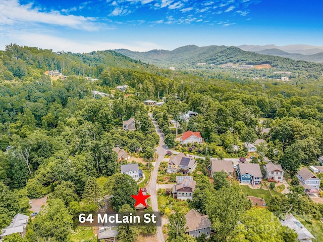 64 Mclain St, Asheville, NC 28803 - aerial perspective of suburban area featuring a heavily wooded area and a mountainous background