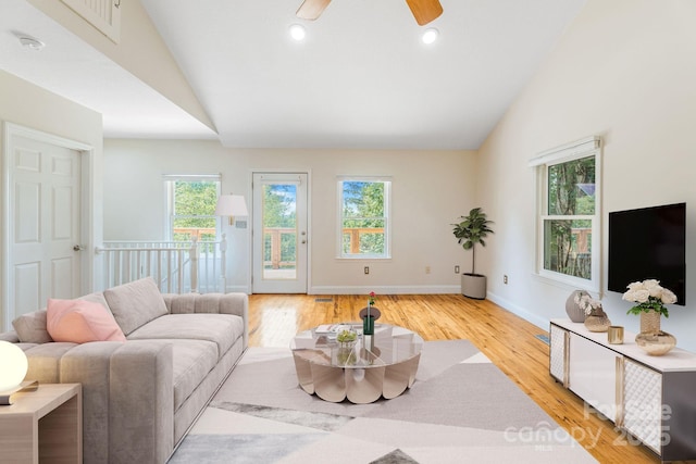 64 Mclain St, Asheville, NC 28803 - living area featuring lofted ceiling, plenty of natural light, light wood-type flooring, ceiling fan, and baseboards