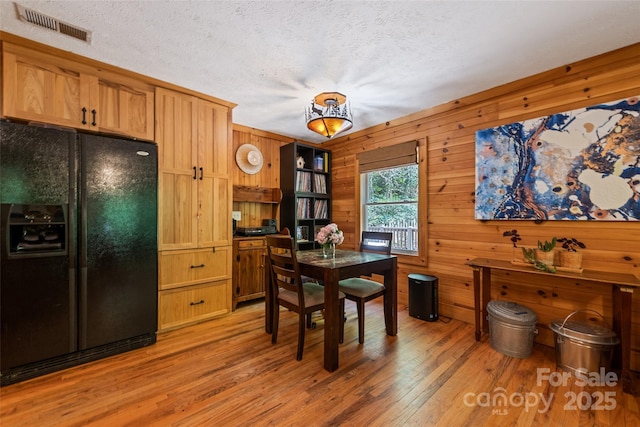 823 Turtle Creek Rd, Sylva, NC 28779 - dining space featuring light wood finished floors, a textured ceiling, and wooden walls