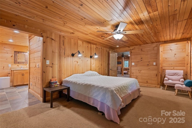 823 Turtle Creek Rd, Sylva, NC 28779 - bedroom featuring wood walls, wood ceiling, ensuite bathroom, and a sink