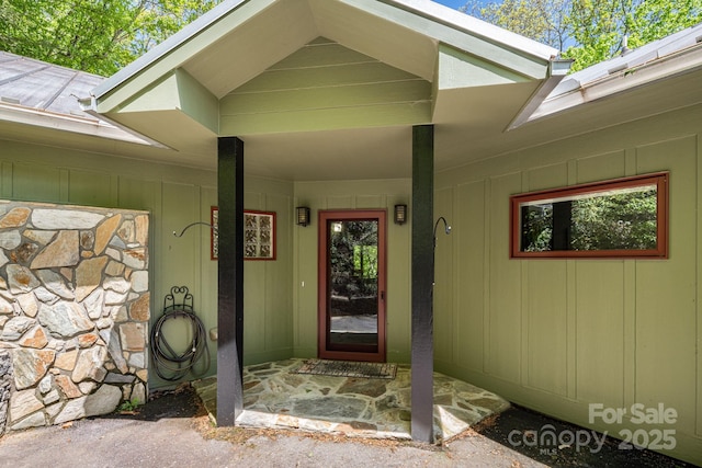 1760 Winding Creek Dr, Waynesville, NC 28786 - property entrance featuring covered porch and stone siding